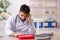 Young male paramedic working in the clinic