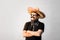 Young male person dressed up in traditional mexican sombrero, fa