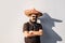 Young male person dressed up in traditional mexican sombrero, fa