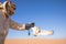 Young male pharaoh eagle owl during a desert falconry show in Dubai, UAE.