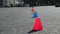 Young male roller skater  blading slalom elements cones