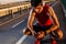 Young male runner with headphones looking at his mobile phone.