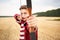 Young male sportsman targeting with bow in a traditional, medieval archer costume - Teenager archer practicing archery in nature