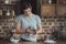 young male teenager cleaning dinnerware with towel