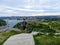 A young male tourist walking up signal hill towards cabot tower.  A famous landmark in St. Johns, Newfoundland, Canada.