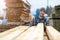 Young male worker in timber warehouse