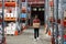 Young male worker of warehouse carrying boxes