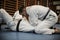 Young males practicing judo together.