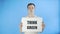 Young Man Activist With Think Green Poster on blue background