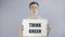 Young Man Activist With Think Green Poster on grey background