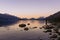 Young man admiring the beuaty in Lake Wakatipu sunset. New Zealand, South Island