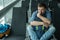 Young man at the airport waiting for his plane looking at the windoe