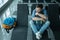 Young man at the airport waiting for his plane looking at the window