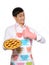 Young man in apron baked tasty pie