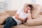 Young man asleep in front of TV