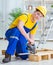 The young man assembling wood pallet