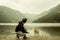 Young man from backwards plays with a dog in a beautiful landscape from the heart of Glendalough valley in Ireland