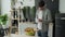 A young man with a bag of groceries checks and examines a product receipt after buying food at a grocery store. Man