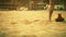 Young man bare feet in summer day on beach soccer field outdoor with beach ball close up dolly