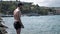 Young man at the beach, diving into the sea