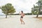 Young man on the beach, young muscular man exercising on the beach, young muscular man doing bodibuilding exercises on the beach,