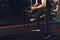 A young man with a beard does an exercise with battle ropes in the gym