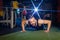 A young man with a beard does a push-up exercise in the gym