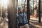 A young man with a beard walks in a pine forest. Portrait of a brutal bearded man Autumn forest