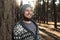 A young man with a beard walks in a pine forest. Portrait of a brutal bearded man Autumn forest