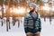 Young man with a beard walks in a pine forest. Portrait of a brutal bearded man. Autumn forest