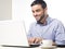 Young Man with Beard working on Laptop