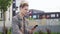 Young man with bicycle and smartphone in city