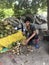 Young man with a big smile and a big knife in India