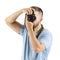 A young man with a black camera isolated on a white background