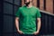 Young man with blank green t-shirt standing on street Mock up Ai generative