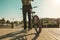 Young man with a bmx bike and a backpack in the city