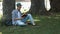 Young man with book in the park