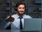 Young man in call center concept working late overtime in office