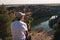 Young man with a cap enjoying the landscape of the Natural Park Hoces del RÃ­o DuratÃ³n located in Segovia in Spain