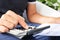 Young man checking a bill, a budget or a payroll