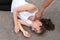 Young man checking pulse of  woman on street