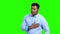 Young man with chest pain on green screen.