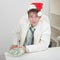 Young man with christmas hat and premium