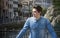 Young man on city bridge in Treviso, Italy