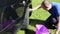 Young man clean wash his favourite car wheel with soap on grass