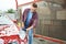 Young man cleaning vehicle with brush