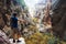 Young man climbed a rock, trekking in a gorge.