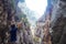 Young man climbed a rock, trekking in a gorge.