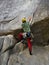 Young man is climbing crack in the rock in Squamish in sector Burgers and Fries.