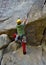 Young man is climbing crack in the rock in Squamish in sector Burgers and Fries.